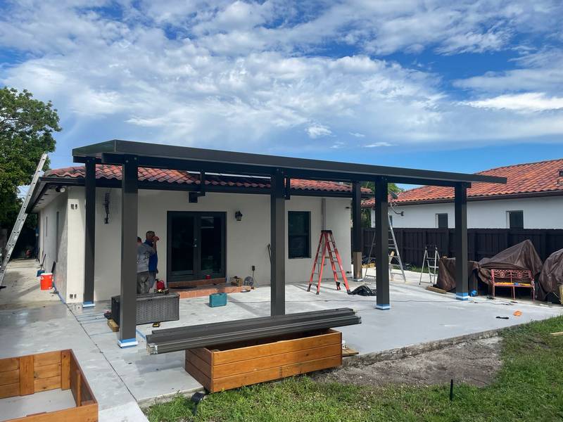Outdoor dining area under a pergola